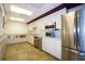 Well-equipped community kitchen featuring stainless steel appliances at 647 White Pine Tree Rd # 34, Venice, FL 34285