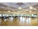 Spacious community room with ample seating and modern light fixtures at 647 White Pine Tree Rd # 34, Venice, FL 34285