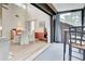 Open concept dining area with view to balcony and living room at 647 White Pine Tree Rd # 34, Venice, FL 34285