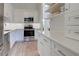 Modern kitchen with stainless steel appliances and white cabinets at 647 White Pine Tree Rd # 34, Venice, FL 34285