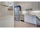 Modern kitchen with stainless steel appliances and white cabinets at 647 White Pine Tree Rd # 34, Venice, FL 34285