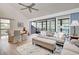 Spacious living room with vaulted ceiling and access to balcony at 647 White Pine Tree Rd # 34, Venice, FL 34285