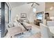 Relaxing living room with comfortable seating and access to a balcony at 647 White Pine Tree Rd # 34, Venice, FL 34285