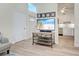 Living room features a flat-screen TV and open concept to kitchen at 647 White Pine Tree Rd # 34, Venice, FL 34285