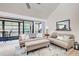 Comfortable living room featuring neutral decor and sliding doors to balcony at 647 White Pine Tree Rd # 34, Venice, FL 34285