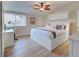 Spacious main bedroom with a king-size bed and built-in storage at 647 White Pine Tree Rd # 34, Venice, FL 34285