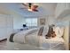 Main bedroom featuring a king-size bed and ceiling fan at 647 White Pine Tree Rd # 34, Venice, FL 34285