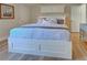 Spacious main bedroom with king-size bed and built-in storage at 647 White Pine Tree Rd # 34, Venice, FL 34285