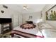 Comfortable bedroom with queen bed, built-in wardrobe, and TV at 756 White Pine Tree Rd # 211, Venice, FL 34285