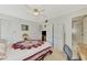 Spacious bedroom with a queen bed, built-in wardrobe, and en-suite bathroom at 756 White Pine Tree Rd # 211, Venice, FL 34285