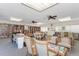 Relax in this well-lit community room with ample seating and books at 756 White Pine Tree Rd # 211, Venice, FL 34285