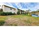 Exterior view of condo building near canal at 756 White Pine Tree Rd # 211, Venice, FL 34285