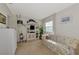 Bright guest room with sofa, shelving, and window with view at 756 White Pine Tree Rd # 211, Venice, FL 34285