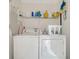 Laundry room with washer, dryer, and shelving for storage at 756 White Pine Tree Rd # 211, Venice, FL 34285