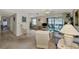 Living room features view to balcony and adjacent dining area at 756 White Pine Tree Rd # 211, Venice, FL 34285