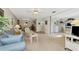 Living room with view into dining area and kitchen at 756 White Pine Tree Rd # 211, Venice, FL 34285