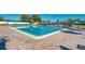 Large community pool with plenty of seating at 756 White Pine Tree Rd # 211, Venice, FL 34285