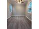 Bright bedroom with wood-look floors and new windows at 8500 Agress Ave, North Port, FL 34287