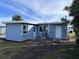 Rear view of newly renovated light blue house at 8500 Agress Ave, North Port, FL 34287