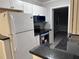 Modern kitchen with white shaker cabinets and stainless steel appliances at 8500 Agress Ave, North Port, FL 34287