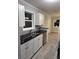Modern kitchen with white shaker cabinets and granite countertops at 8500 Agress Ave, North Port, FL 34287