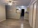 Open living room and kitchen with grey vinyl flooring at 8500 Agress Ave, North Port, FL 34287