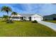 Attractive single-story home with landscaped lawn and driveway at 917 S Gondola Dr, Venice, FL 34293