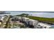 Aerial view showcasing condos near water with boat parking and neighborhood at 9203 Griggs Rd # B202, Englewood, FL 34224
