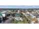 Aerial view of condo community including pool, putting green and surrounding neighborhood at 9203 Griggs Rd # B202, Englewood, FL 34224