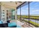 Outdoor balcony features comfortable seating and expansive waterfront views at 9203 Griggs Rd # B202, Englewood, FL 34224