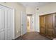 Bright bedroom featuring a large closet and a view into the attached bathroom at 9203 Griggs Rd # B202, Englewood, FL 34224