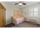 Well-decorated bedroom with trundle bed, natural light, and a woven storage chest at 9203 Griggs Rd # B202, Englewood, FL 34224