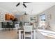 Open dining area featuring views of the open concept kitchen and comfortable seating at 9203 Griggs Rd # B202, Englewood, FL 34224