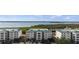 Condo building complex with water views and lush green surroundings at 9203 Griggs Rd # B202, Englewood, FL 34224