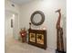 Hallway features a decorative cabinet, mirror and an ornamental giraffe at 9203 Griggs Rd # B202, Englewood, FL 34224