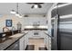 Bright kitchen with stainless steel appliances and granite countertops at 9203 Griggs Rd # B202, Englewood, FL 34224