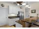 Kitchen with granite countertops, stainless steel fridge, and breakfast bar at 9203 Griggs Rd # B202, Englewood, FL 34224
