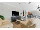 Open-concept living space with views into the kitchen and bar seating at 9203 Griggs Rd # B202, Englewood, FL 34224
