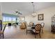 Spacious open-concept living and dining area with large windows and tile floors at 9203 Griggs Rd # B202, Englewood, FL 34224