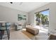 Bright lounge with sliding glass doors and comfortable seating at 9203 Griggs Rd # B202, Englewood, FL 34224