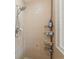 Tiled shower stall with adjustable shower head and convenient corner shelving at 9203 Griggs Rd # B202, Englewood, FL 34224