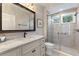 Bathroom with marble vanity and walk-in shower at 1010 Grouse Way, Venice, FL 34285