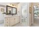 Bathroom with double vanity and separate toilet area at 1010 Grouse Way, Venice, FL 34285