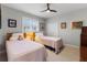 Guest bedroom with twin beds and ample closet space at 1010 Grouse Way, Venice, FL 34285