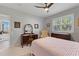 Bedroom with queen bed and vanity area at 1010 Grouse Way, Venice, FL 34285