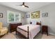 Bedroom with queen bed and built-in dresser at 1010 Grouse Way, Venice, FL 34285