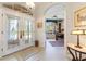 Bright and spacious entryway with glass doors and views to an office at 1010 Grouse Way, Venice, FL 34285