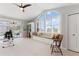 Bright exercise room with pool view and window seat at 1010 Grouse Way, Venice, FL 34285