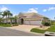 Beautiful home with a two-car garage and well-maintained lawn at 1010 Grouse Way, Venice, FL 34285