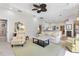 Spacious living room with comfortable seating and a view of the kitchen at 1010 Grouse Way, Venice, FL 34285